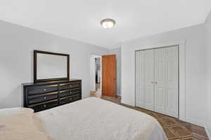 Bedroom with a closet and baseboards