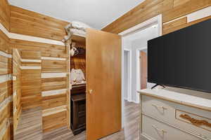 Walk in closet featuring light wood finished floors