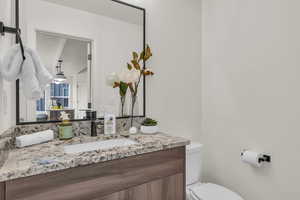 Bathroom with vanity and toilet