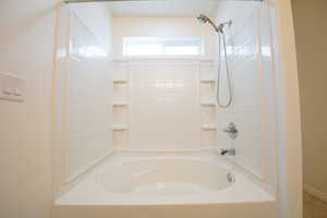 Bathroom featuring  shower combination