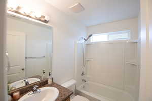 Full bath featuring bathing tub / shower combination and vanity