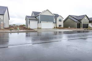 View of asphalt street with sidewalks and a residential view