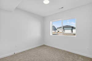 Unfurnished room featuring baseboards and carpet floors