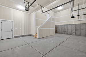 Garage featuring a garage door opener