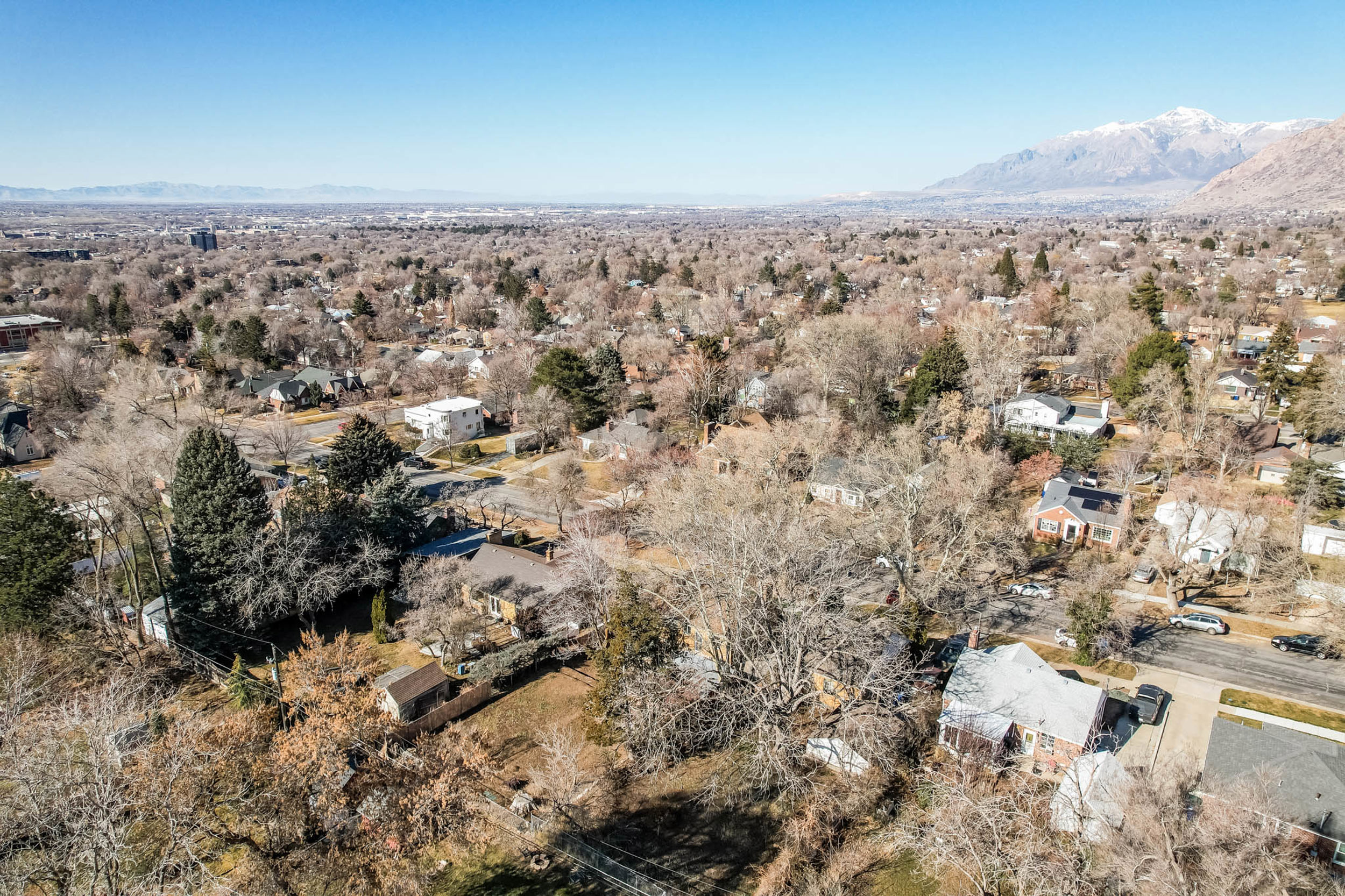 View of property location with mountains and nearby suburban area