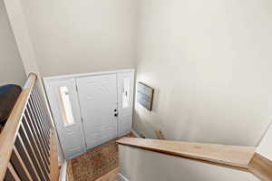 Entryway featuring light wood-style floors and stairway