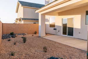 Fenced yard with a patio area
