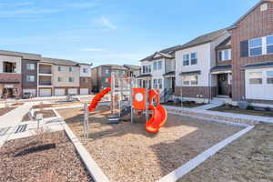 Community jungle gym with a residential view