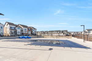 Community pool with a residential view