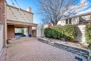 View of patio / terrace featuring a shed
