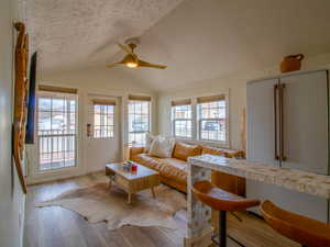 Living area featuring wood finished floors and ceiling fan