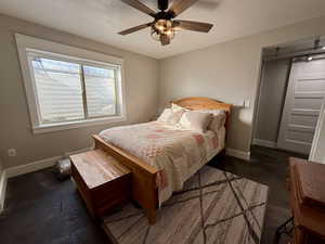 Bedroom with baseboards and a ceiling fan