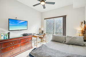 Bedroom with light carpet, ceiling fan, and access to exterior