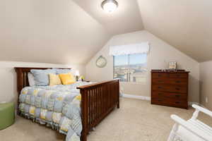 Carpeted bedroom featuring baseboards