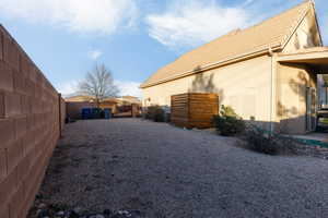 Fenced backyard featuring a gate