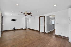 Spare room featuring ceiling fan, dark wood-style flooring, recessed lighting, and a textured ceiling