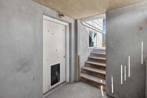 Stairs featuring concrete floors