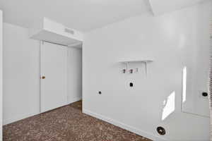 Unfurnished bedroom featuring carpet flooring and baseboards