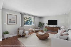Living area featuring wood finished floors and baseboards