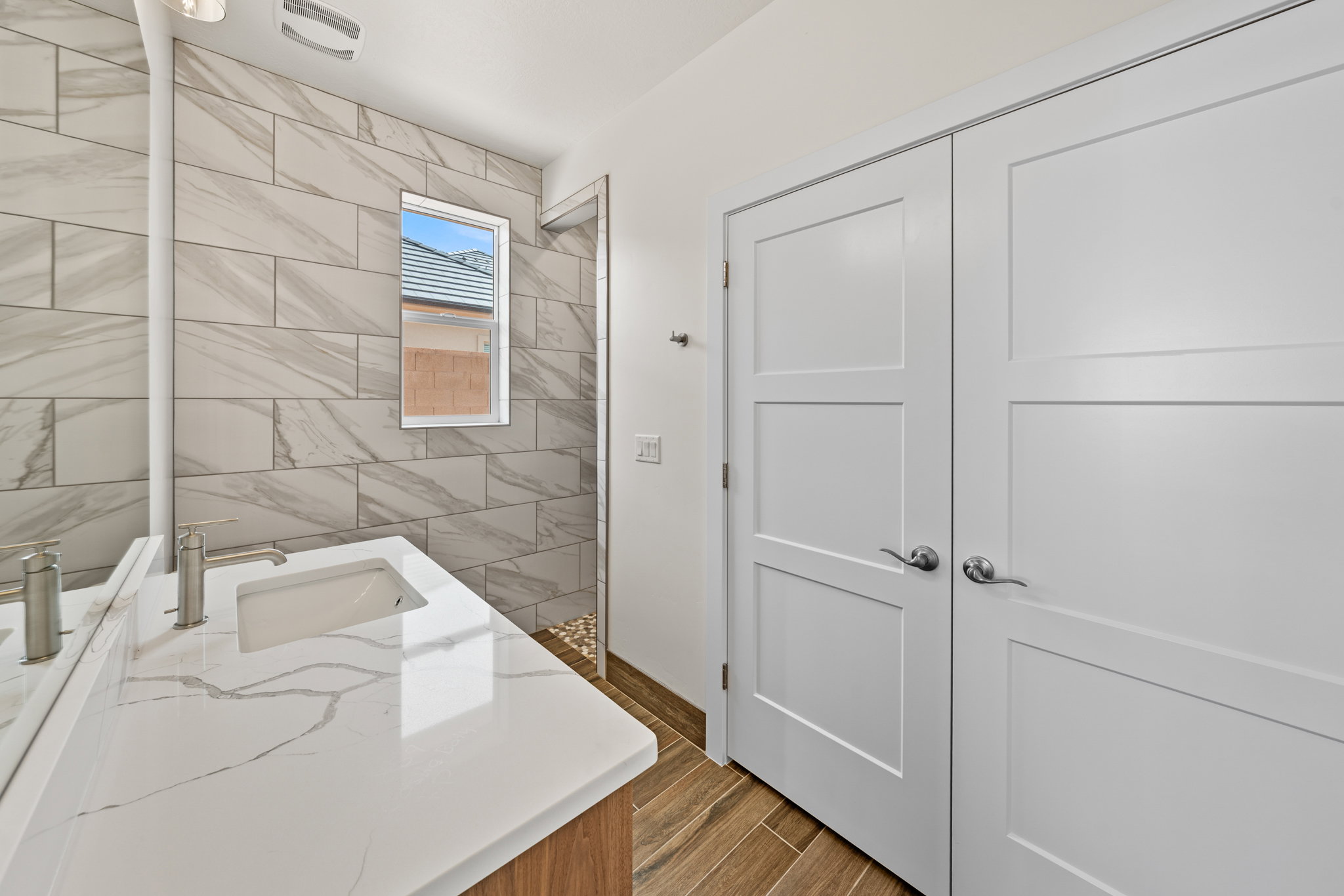 Bathroom with vanity and wood finish floors
