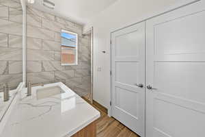 Bathroom with vanity and wood finish floors