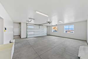 Garage featuring baseboards