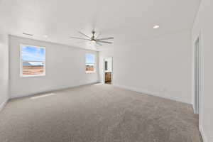 Spare room featuring light carpet, recessed lighting, and ceiling fan