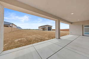 View of patio with an outdoor structure