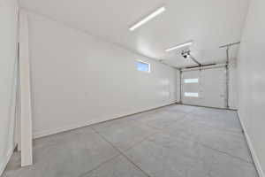 Garage featuring baseboards