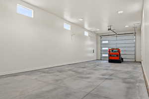 Garage featuring baseboards