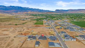 Aerial perspective of suburban area with a mountainous background