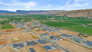 View of property location with a mountainous background and nearby suburban area