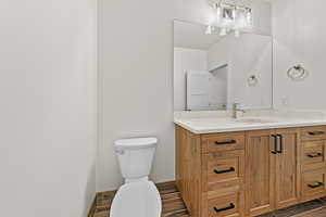 Bathroom with toilet and vanity
