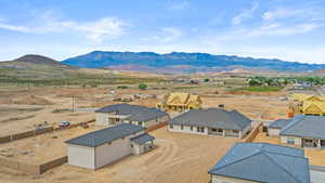 Aerial perspective of suburban area featuring a mountainous background