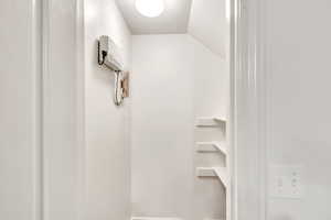 Bathroom with vaulted ceiling