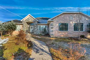 View of front of home featuring brick siding