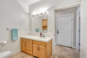 Bathroom with vanity and light tile patterned flooring