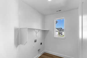 Laundry area featuring washer hookup and dark wood-style flooring