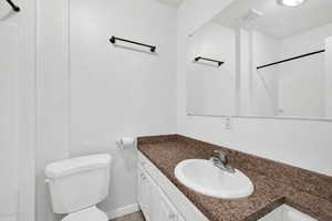 Full bath with vanity and a shower