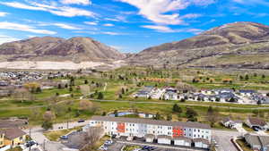 Aerial perspective of suburban area with a water and mountain view