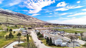 Aerial perspective of suburban area with a mountainous background