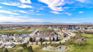 Aerial perspective of suburban area with a mountainous background