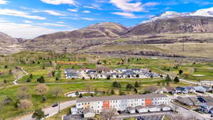 Aerial view of residential area featuring a mountainous background