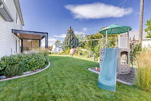 View of jungle gym featuring a yard