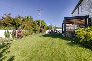 Fenced yard featuring a playground