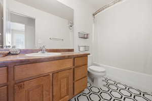 Bathroom featuring vanity and shower / bath combo