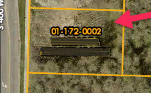 Aerial map of property and surrounding area with property parcel outlined