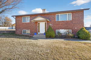 View of front of property with brick siding and entry steps