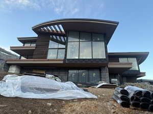 Rear view of house with a balcony