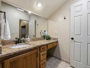 Bathroom with vanity and a textured ceiling